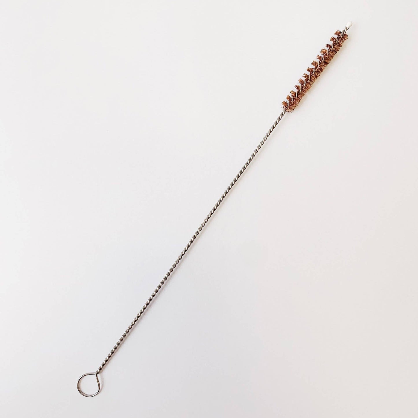 Stainless steel wire and coconut bristles.