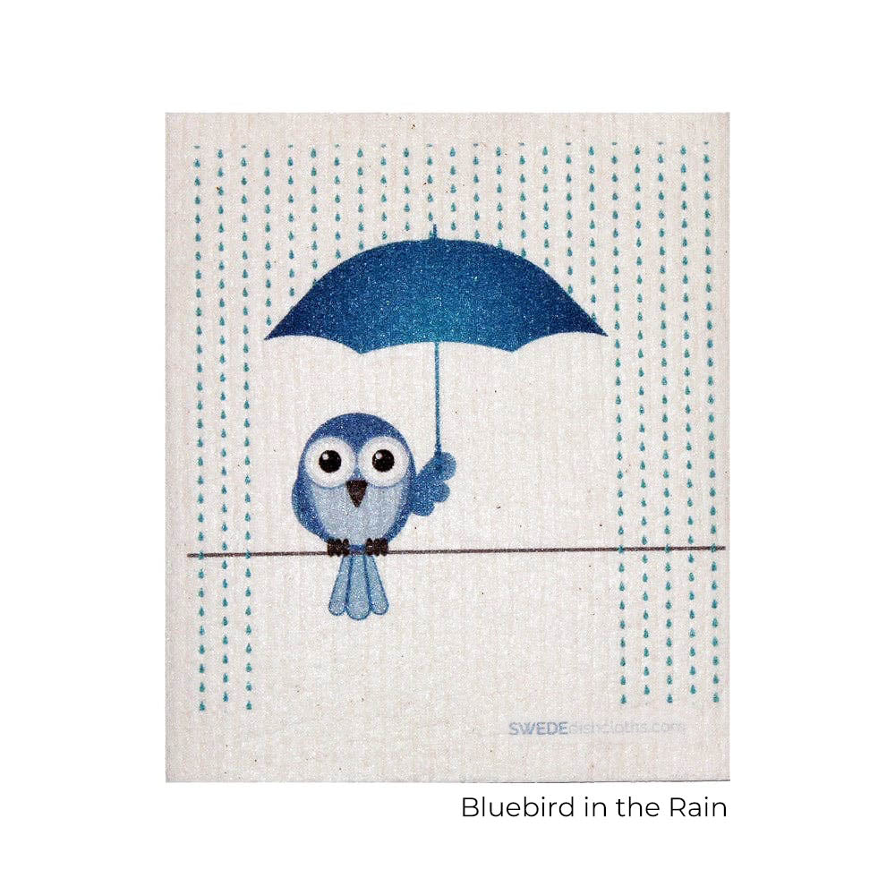 https://worldofyourchoice.com/cdn/shop/files/Bluebird-with-Umbrella-Swedish-Dishcloth-name.jpg?v=1699485424&width=1445