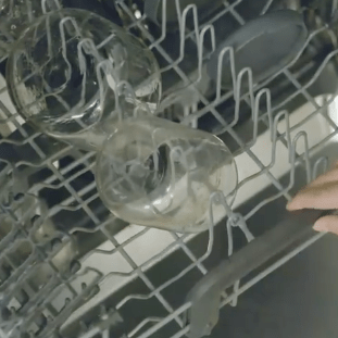 glass container being cleaned in dishwasher