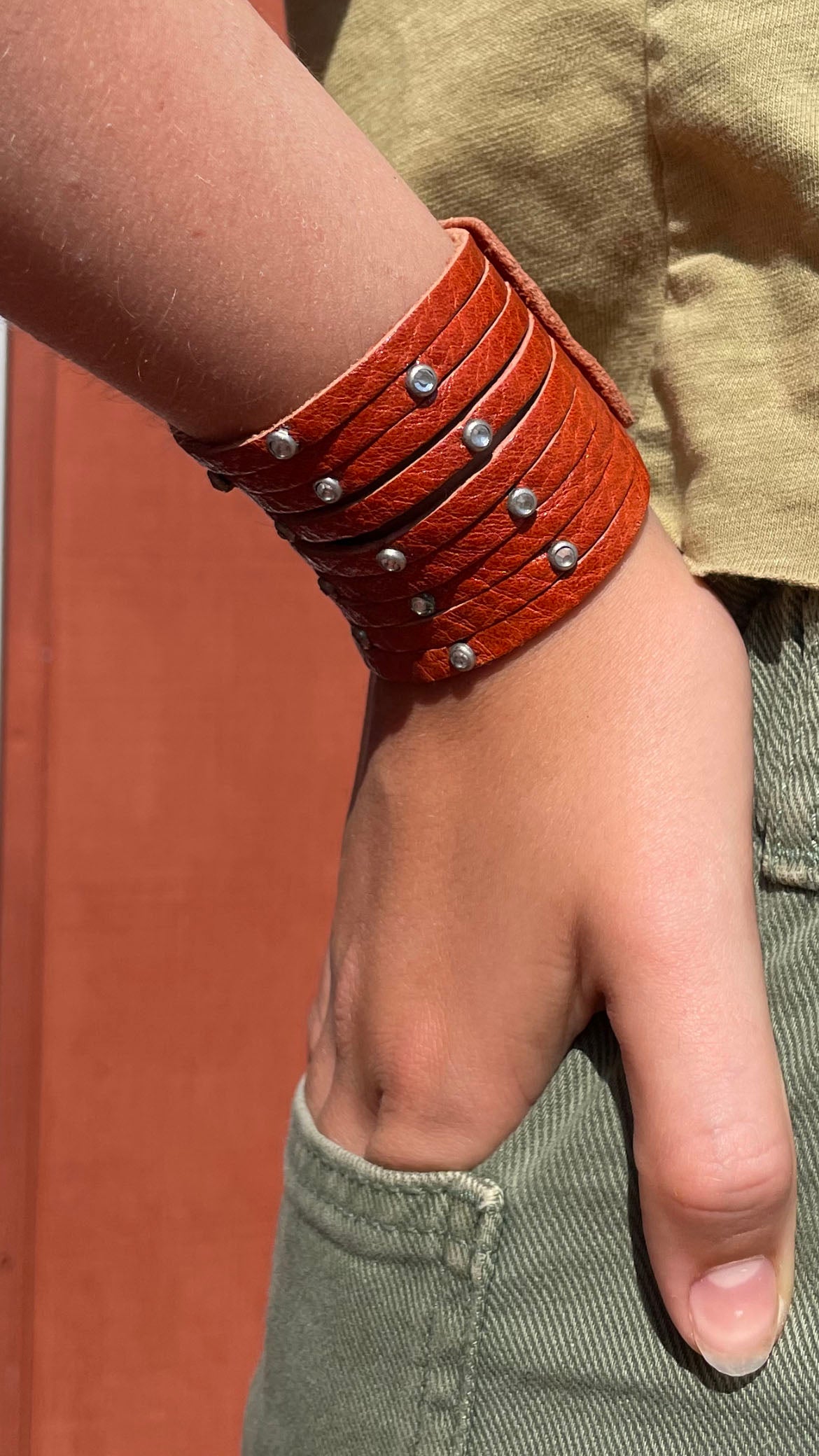 Orange with Studs.  2" wide genuaine leather ribbed bracelet 