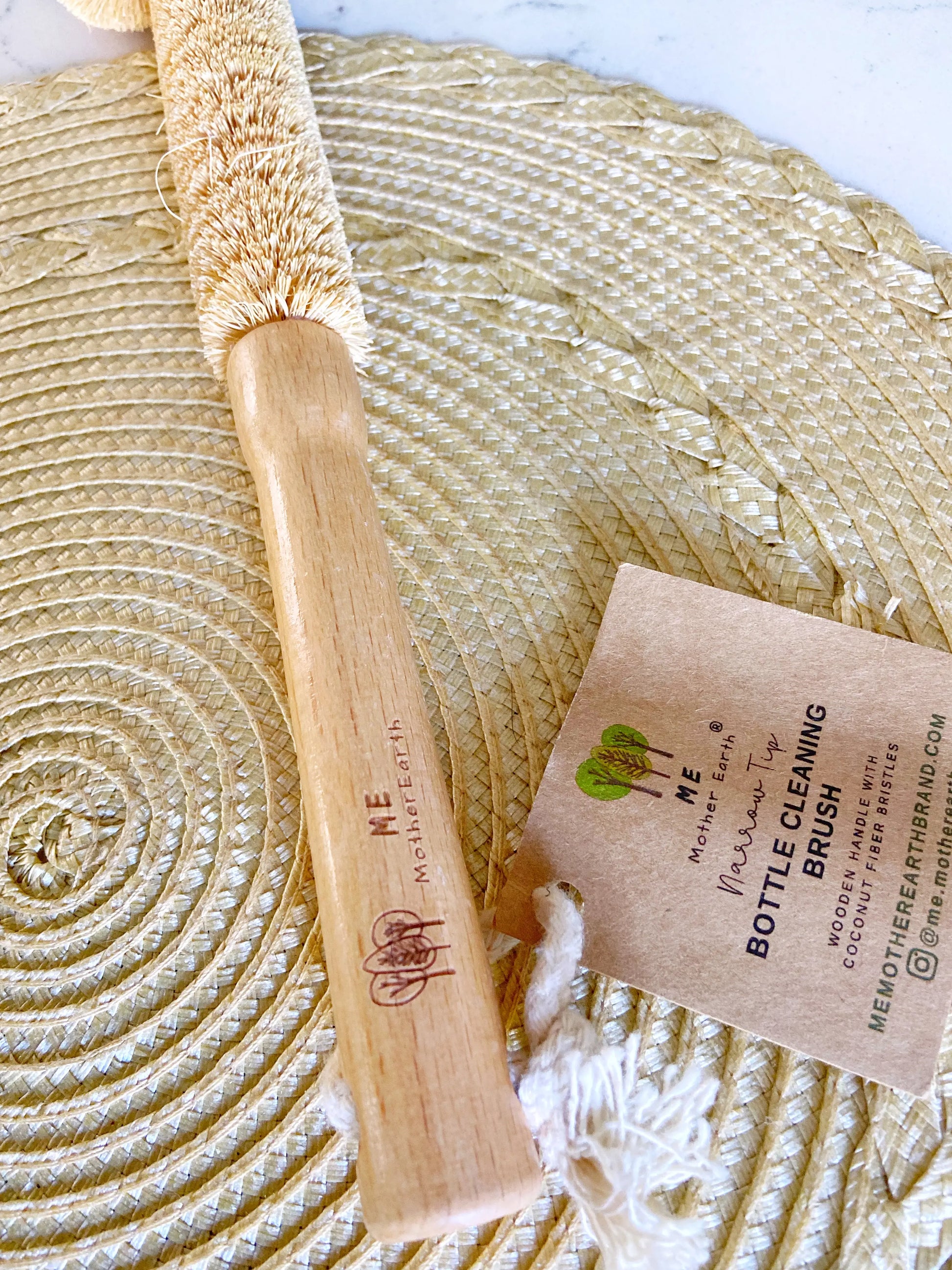 Bamboo handle of  bottle cleaning brush. On rattan matt