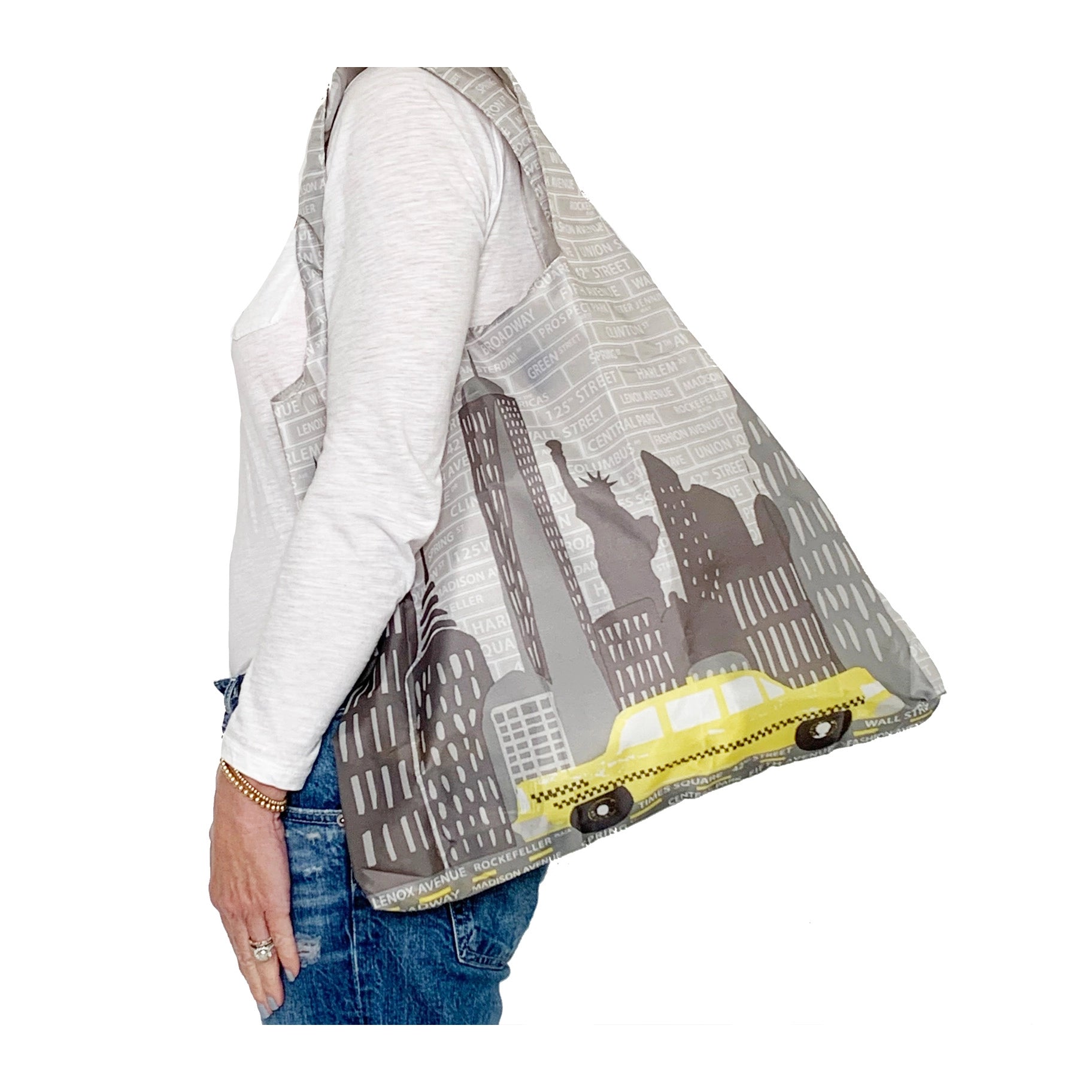 Woman wearing NYC reusable shopping bag - full display