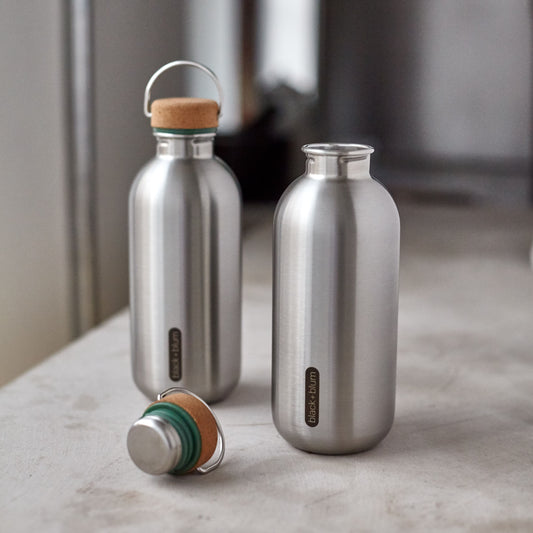 2 stainless steel water bottles with cork lid and olive green accent