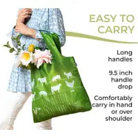 reusable shopper, support your local farmer white graphics on green background. Woman carrying bag with groceries