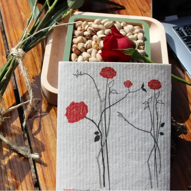 Swedish dish cloth with minimal red roses and food