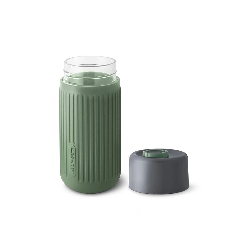 Travel cup insulated glass and 100% leak proof cap. It tastes better in glass. Coffee, tea, chocolate, hot or cold beverages. Reusable glass insulated cup with olive colored silicone. shown with open lid
